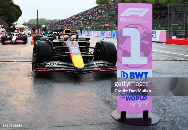 Pole position qualifier Max Verstappen of the Netherlands driving the Oracle Red Bull Racing RB18 stops in parc ferme during qualifying ahead of the...