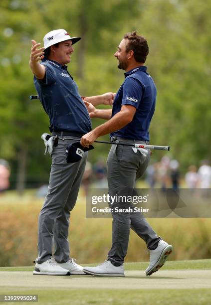 Joel Dahmen and Stephan Jaeger of Germany react on the 18th green during the second round of the Zurich Classic of New Orleans at TPC Louisiana on...