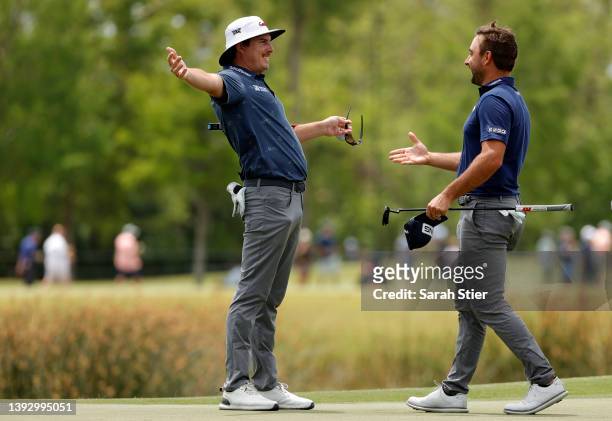 Joel Dahmen and Stephan Jaeger of Germany react on the 18th green during the second round of the Zurich Classic of New Orleans at TPC Louisiana on...