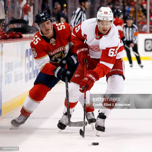 Danny DeKeyser of the Detroit Red Wings tangles with Noel Acciari of the Florida Panthers at the FLA Live Arena on April 21, 2022 in Sunrise, Florida.