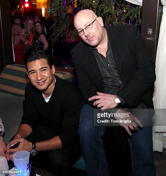 Mario Lopez and Agent Mike Esterman pose in a cabana while visiting The Pool After Dark at Harrah's Resort on Saturday February 18, 2012 in Atlantic...