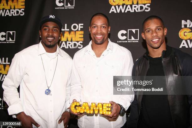 Players Hakeem Nicks, Victor Cruz and Michael Boley of the New York Giants pose in the press room during the Cartoon Network's Hall Of Game Awards at...