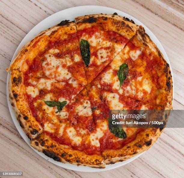 pizza,high angle view of pizza on table - pizza napoletana fotografías e imágenes de stock