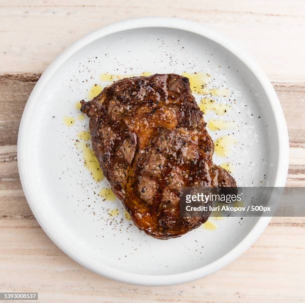 food,directly above shot of meat in bowl on table - steek stock pictures, royalty-free photos & images