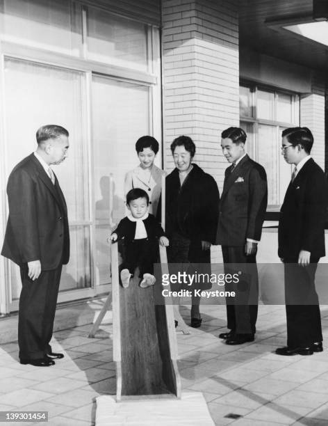 Members of the Japanese Imperial Family are photographed for their New Year's Day picture in the grounds of the Imperial Palace in Tokyo, 27th...