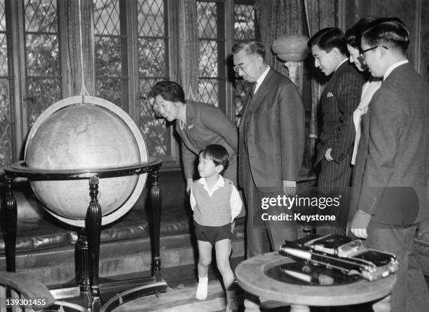 Members of the Japanese Imperial Family are photographed for their New Year's Day picture at the Kaintei Rest House in the grounds of the Imperial...