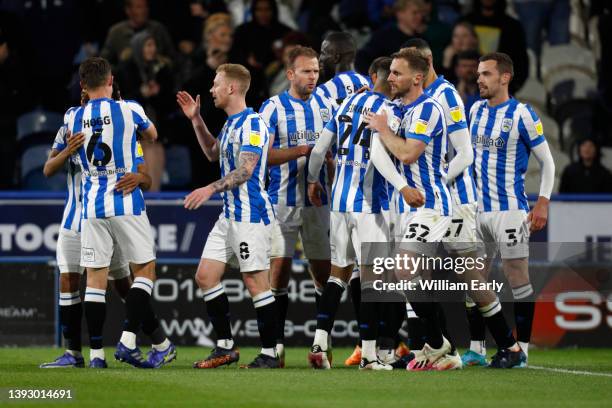 Huddersfield Town players celebrate Harry Toffolo's goal during the Sky Bet Championship match between Huddersfield Town and Barnsley at John Smith's...