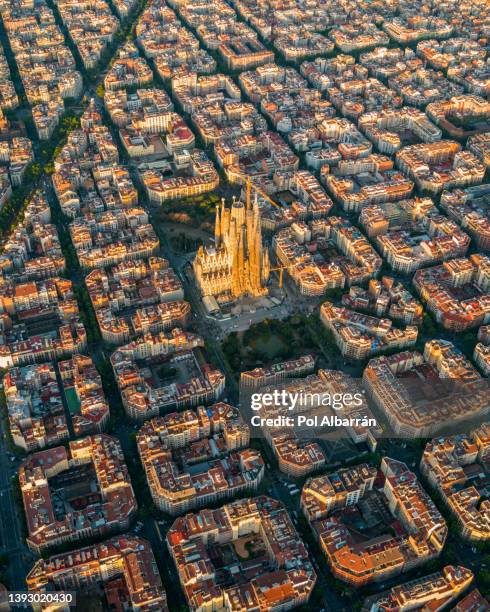 aerial view of barcelona and sagrada familia cathedral at sunrise. catalonia, spain - barcelona aerial stock-fotos und bilder