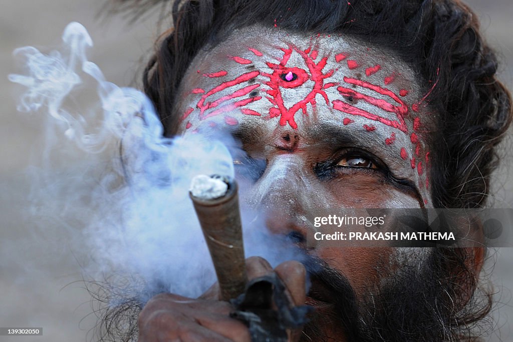 A Sadhu (Hindu holy man) smokes marijuan