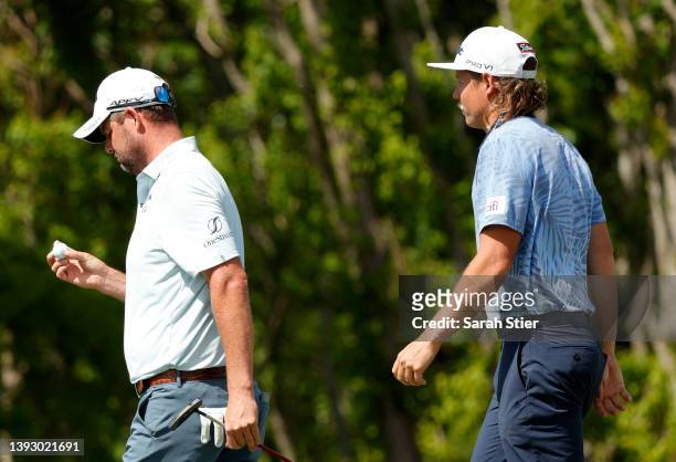 Marc Leishman of Australia and Cameron Smith of Australia walk on the tenth green during the second round of the Zurich Classic of New Orleans at TPC...
