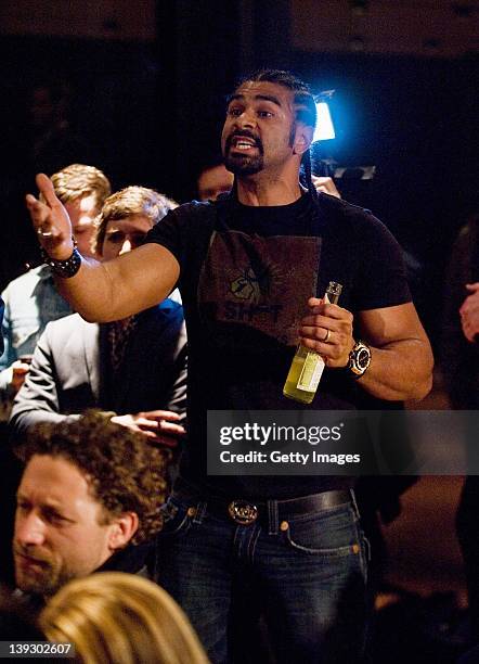 David Haye of Great Britain interrupts speakers on stage leading to a brawl between himself and Dereck Chisora of Great Britain during a press...