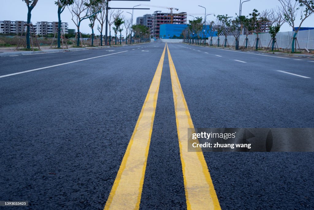 Asphalt pavement under cloudy sky