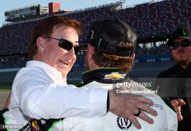 Team owner Richard Childress congratulates Jeffrey Earnhardt, driver of the ForeverLawn Chevrolet, after winning the pole award during qualifying for...