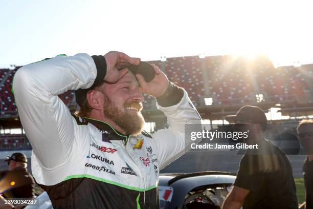 Jeffrey Earnhardt, driver of the ForeverLawn Chevrolet, reacts after winning the pole award during qualifying for the NASCAR Xfinity Series Ag-Pro...