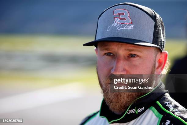 Jeffrey Earnhardt, driver of the ForeverLawn Chevrolet, looks on during qualifying for the NASCAR Xfinity Series Ag-Pro 300 at Talladega...