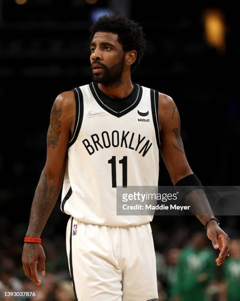Kyrie Irving of the Brooklyn Nets looks on during the third quarter of Round 1 Game 1 of the 2022 NBA Eastern Conference Playoffs at TD Garden on...