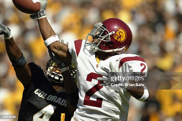 Defensive back Ronald Strickland of the Colorado Buffaloes gets called for interference against wide receiver Kareem Kelly of the Southern California...