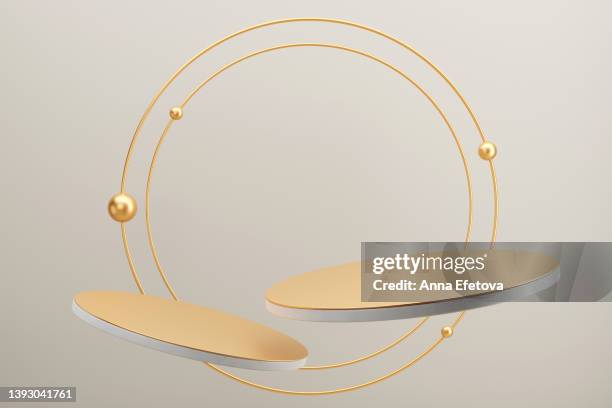 two golden levitating podiums with two golden circle frames on gray background. futuristic 3d illustration for your product demonstration - gold circle 個照片及圖片檔