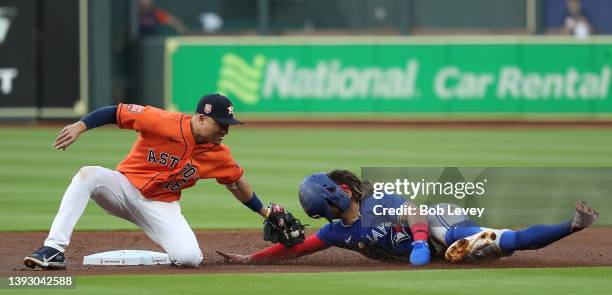 Bo Bichette of the Toronto Blue Jays is tagged out by Aledmys Diaz of the Houston Astros attempting to steal second base in the first inning at...