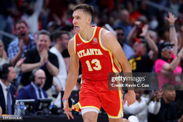 Bogdan Bogdanovic of the Atlanta Hawks celebrates a three pointer against the Miami Heat during the second quarter in Game Three of the Eastern...