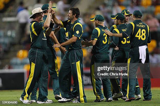 Brett Lee and Ben Hilfenhaus of Australia celebrate winning game seven of the One Day International series between Australia and India at The Gabba...