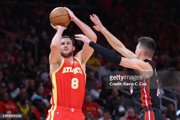 Danilo Gallinari of the Atlanta Hawks shoots a jumper against Tyler Herro of the Miami Heat during the third quarter in Game Three of the Eastern...