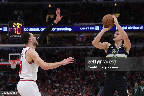 Grayson Allen of the Milwaukee Bucks is defended by Zach LaVine of the Chicago Bulls \d2q of Game Three of the Eastern Conference First Round...
