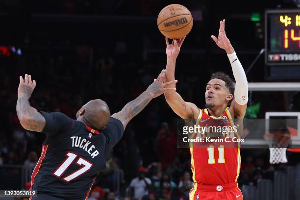 Trae Young of the Atlanta Hawks shoots over P.J. Tucker of the Miami Heat during second half in Game Three of the Eastern Conference First Round at...