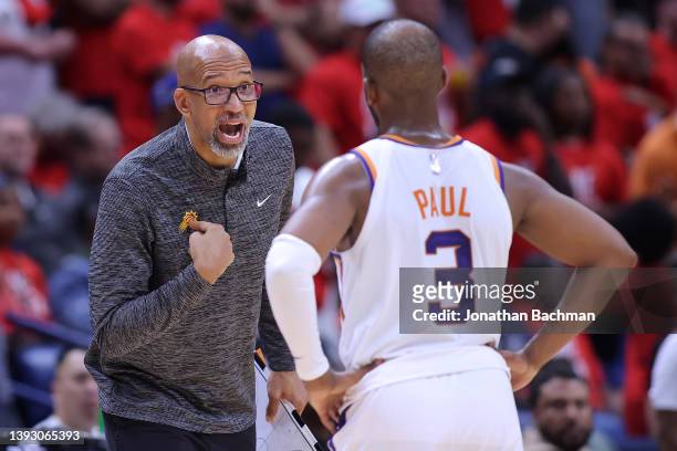 Head coach Monty Williams of the Phoenix Suns talks to Chris Paul during the second half of Game Three of the Western Conference First Round game...
