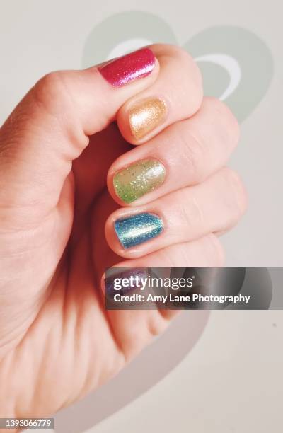 rainbow nails - multi coloured nails stock pictures, royalty-free photos & images