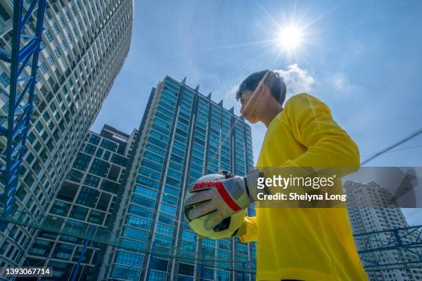 low angle view of   soccer goalkeeper in action - soccer goalkeeper stock pictures, royalty-free photos & images