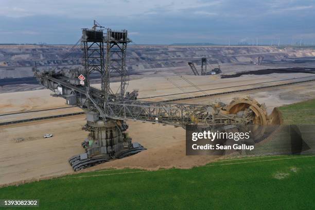 In this aerial view a bucket excavator removes a top layer of soil and sand from former farmland during expansion of the Garzweiler II open-cast...