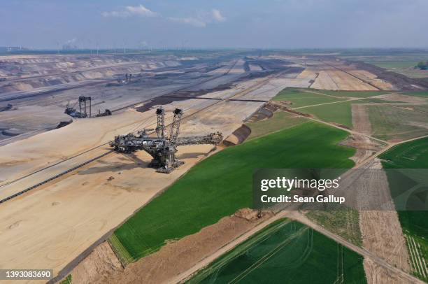 In this aerial view a bucket excavator removes top layers of soil and sand from former farmland during expansion of the Garzweiler II open-cast...