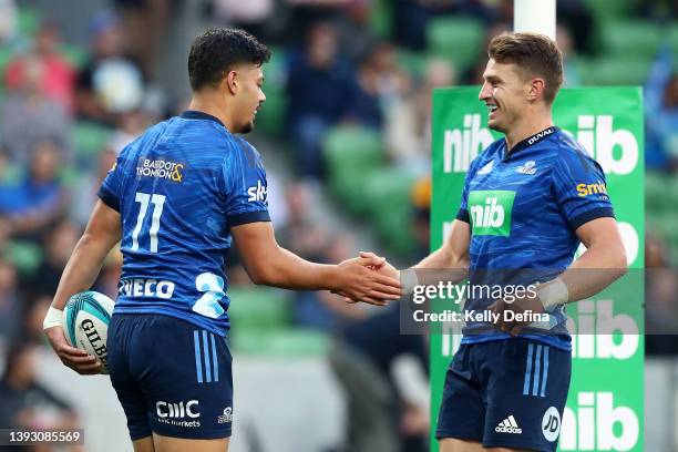 Lam of the Blues celebrates scores a try with Beauden Barrett of the Blues during the round 10 Super Rugby Pacific match between the Blues and the...