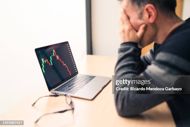 man concerned about the decline in the value of his business - losing money stock pictures, royalty-free photos & images