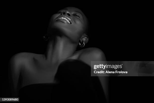 portrait of young beautiful afro woman - ear piercing stock pictures, royalty-free photos & images