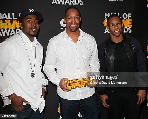 Players Hakeem Nicks, Michael Boley and Victor Cruz pose in the press room during the 2nd Annual Cartoon Network Hall of Game Awards at Barker Hangar...