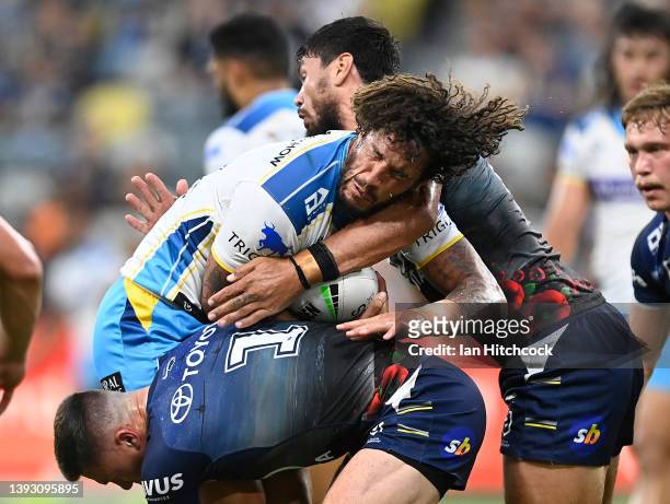 Kevin Proctor of the Titans is tackled during the round seven NRL match between the North Queensland Cowboys and the Gold Coast Titans at Qld Country...