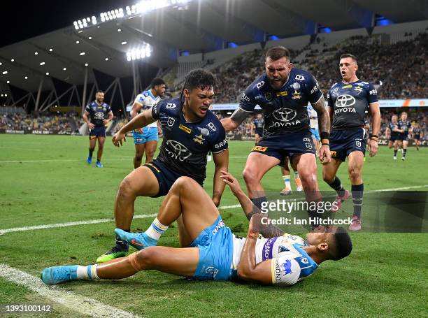 Jeremiah Nanai of the Cowboys celebrates after scoring a try during the round seven NRL match between the North Queensland Cowboys and the Gold Coast...