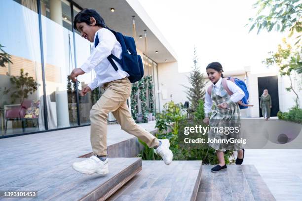 happy schoolchildren returning home from school in riyadh - arab student kids stock pictures, royalty-free photos & images