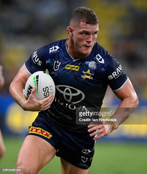 Tom Gilbert of the Cowboys runs the ball during the round seven NRL match between the North Queensland Cowboys and the Gold Coast Titans at Qld...