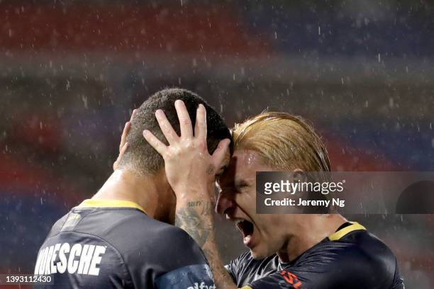 Matheus Celestino Moresche Rodrigues of the Mariners celebrates scoring a goal with Jason Cummings during the A-League Mens match between Newcastle...