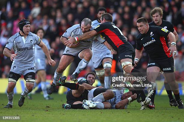 George Chuter of Leivester Tigers is tackled by Andy Saull of Saracens during the Saracens v Leicester Tigers Aviva Premiership match at Vicarage...