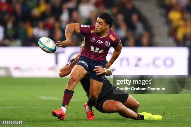 Hunter Paisami of the Reds passes during the round 10 Super Rugby Pacific match between the Hurricanes and the Queensland Reds at AAMI Park on April...