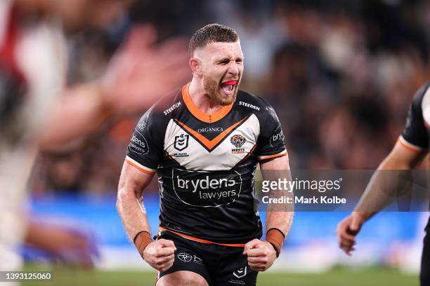 Jackson Hastings of the Tigers celebrates victory during the round seven NRL match between the Wests Tigers and the South Sydney Rabbitohs at...