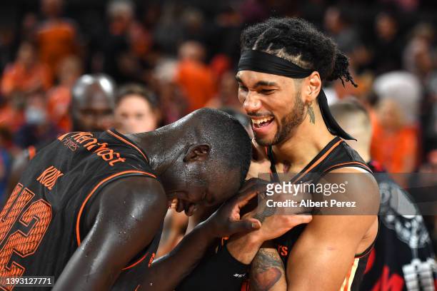 Bul Kuol and Keanu Pinder of the Taipans celebrate victory during the round 21 NBL match between Cairns Taipans and Brisbane Bullets at Cairns...