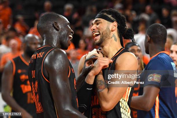 Bul Kuol and Keanu Pinder of the Taipans celebrate victory during the round 21 NBL match between Cairns Taipans and Brisbane Bullets at Cairns...