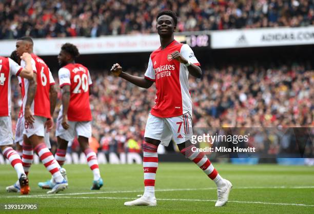 Bukayo Saka of Arsenal celebrates after scoring their side's second goal during the Premier League match between Arsenal and Manchester United at...
