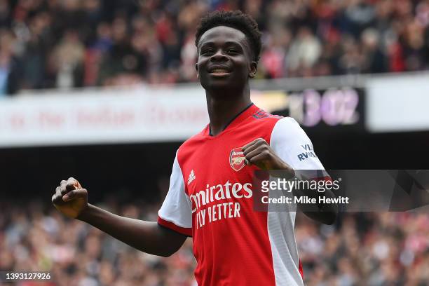 Bukayo Saka of Arsenal celebrates after scoring their side's second goal during the Premier League match between Arsenal and Manchester United at...