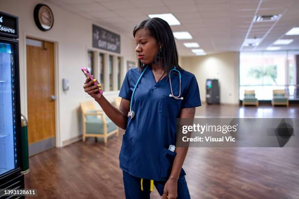 aboriginal using mobile device - healthcare worker beauty in nature stock pictures, royalty-free photos & images